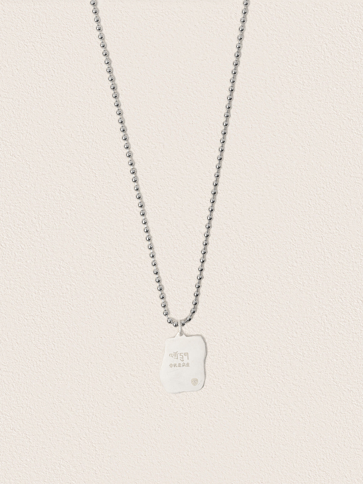 Sacred Carvings of Lhasa Chokpori (Mountain) Necklace