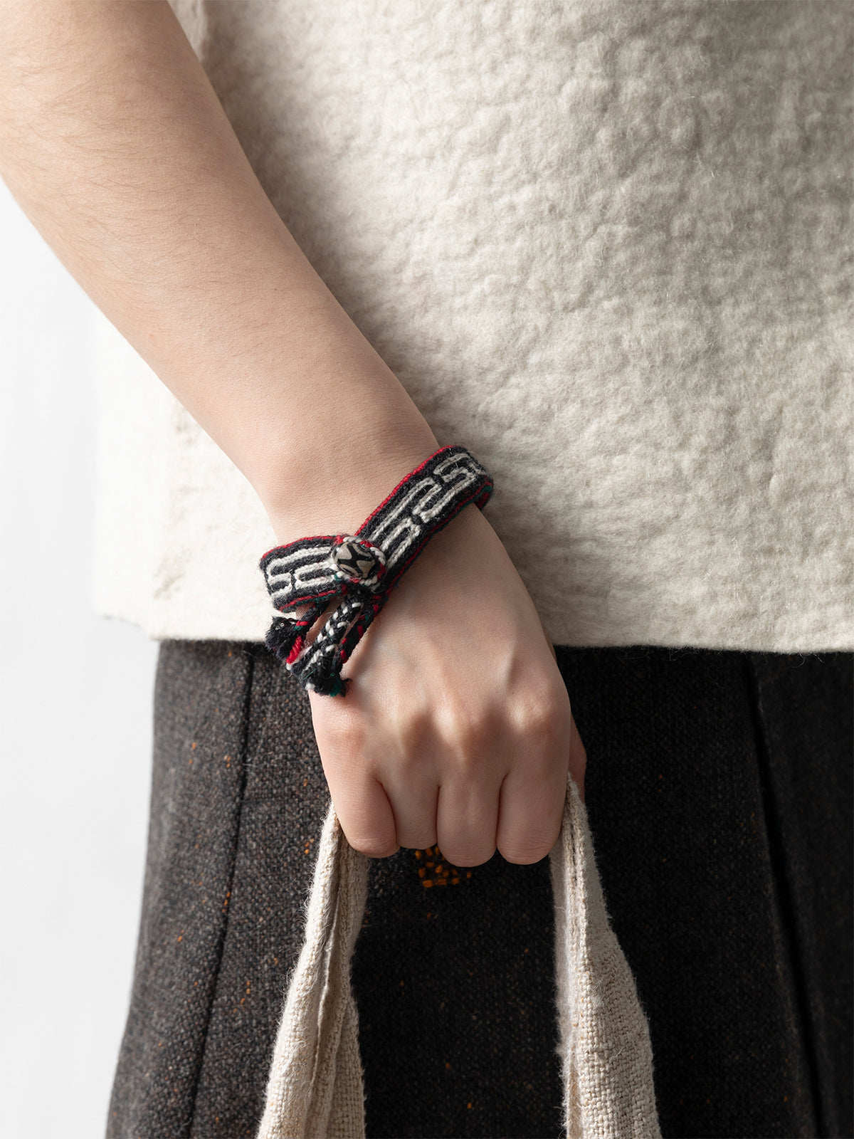 Dzi Bead Handwoven Wool Bracelet